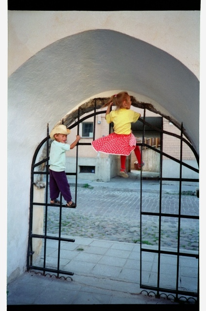 Children climbed at the gate on the Russian street in the Old Town of Tallinn