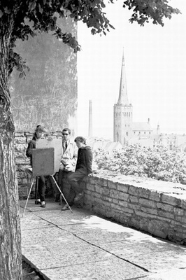 Female artist in Tallinn in Toompea painting.  similar photo