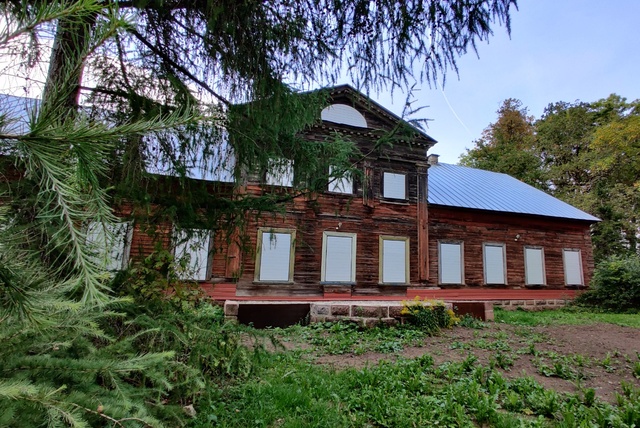 From the back of the bakery manor, from the flower garden1909 rephoto