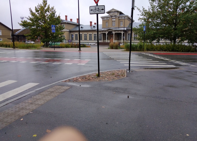 Front side of Tartu Railway Station, two buses are standing at the bus stop rephoto