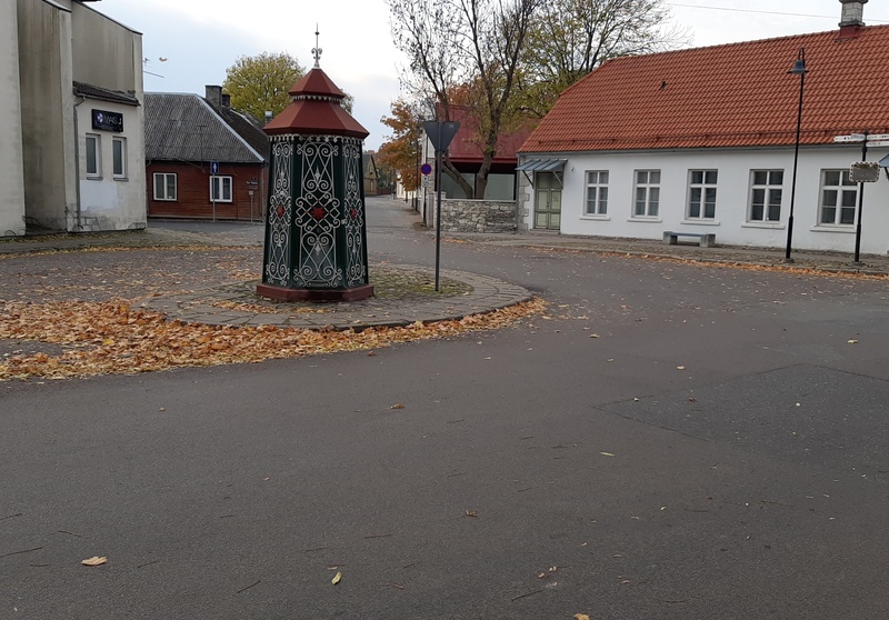 An old town yard with metal coating walls in Kingissepa. rephoto