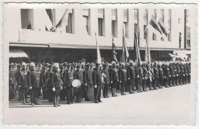 Firefighter row with orchestra and flags on fire parade. Tartu Brigade in 1937.