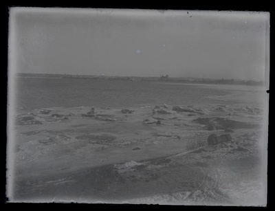 View from the shore to the sea, the sea on the shore frozen.  duplicate photo