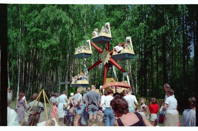 Children in Tallinn Zoo driving with a carousel