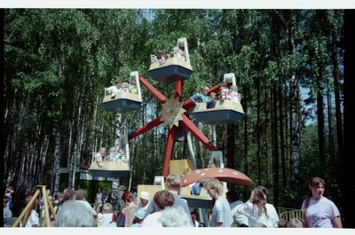 Children riding carousel in Tallinn Animal Garden  similar photo