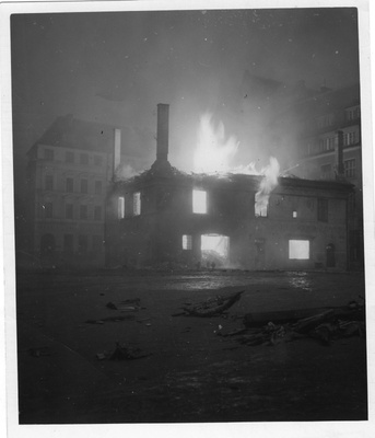 Tallinn after the burning 10.03.1944. Burning old barehouse on the Raekoja square. In the middle of the front edge of a burning barehouse. Behind it the buildings.  duplicate photo