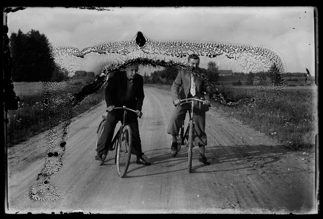 Two suits man with bicycles