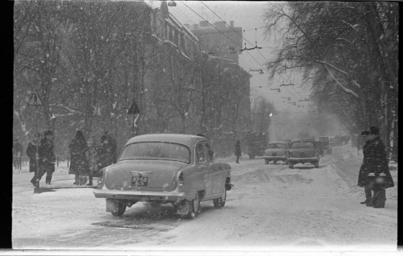 Crossroads with pedestrians and cars