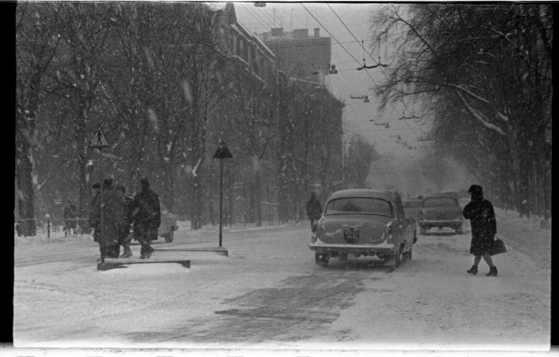 Crossroads with pedestrians and cars