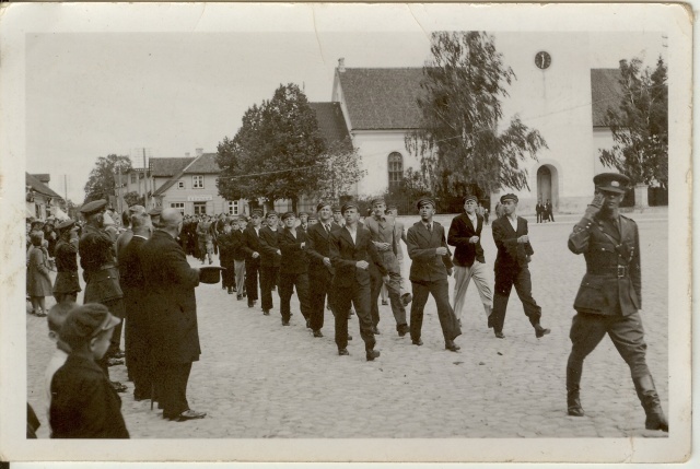 In the photo album Paide Secondary School boys marry at military exercises in the Central Square in the 1930s
