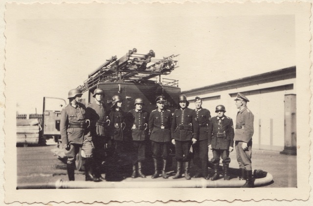 Uniformed team at the fire car in 1943.