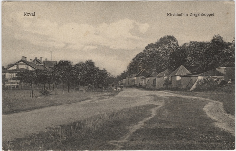 View of the Order (Cople) cemetery in the summer. In front of the midst of the stitched road, on the left young trees, one-two-storey apartments. From the road to the right cemetery with cemetery tables.