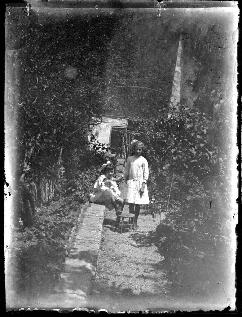 [Portrait of two girls] - Two girls in a garden.