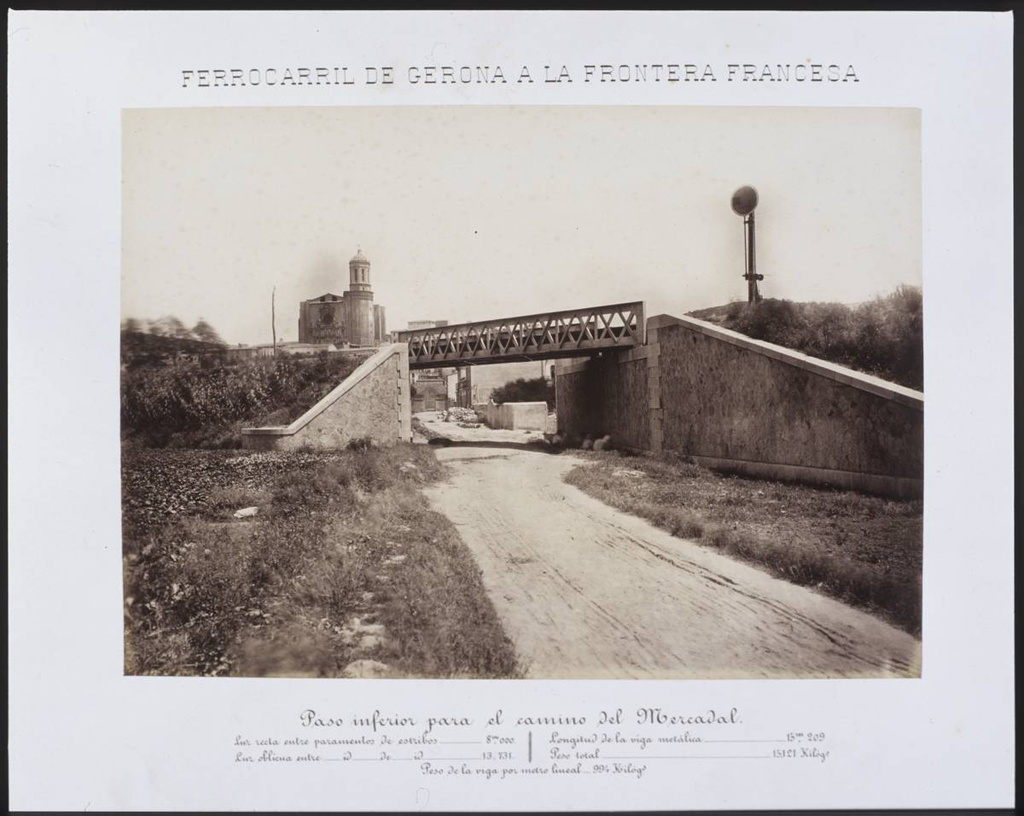 Gerona Railway to the French Border. Lower pass for the Mercadal Road - Access to Ramon Folch Avenue throught the railway bridge. In the background, the Cathedral of Girona.