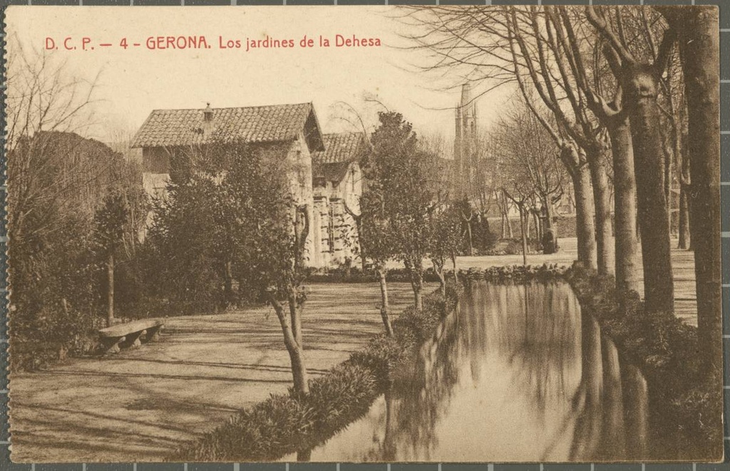 4 - GERONA. The Hedgehogs of Dehesa - Park of the Dehesa with the entrance door to the gardens on the left. First, the stream of the Dehesa. In the background, the bell tower of the church of Sant Feliu.
