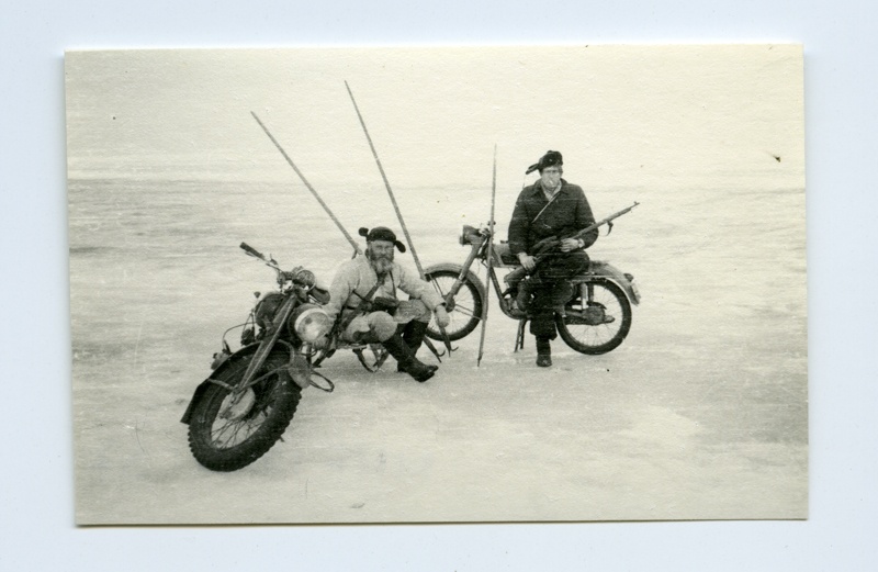 Kihnu seal hunters Juhan Vesik and August Vesik on ice with motorcycles