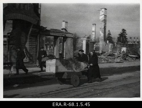Consequences of March bombing in Tallinn: funeral prisoner on the Pärnu road against the background of ruins of broken buildings