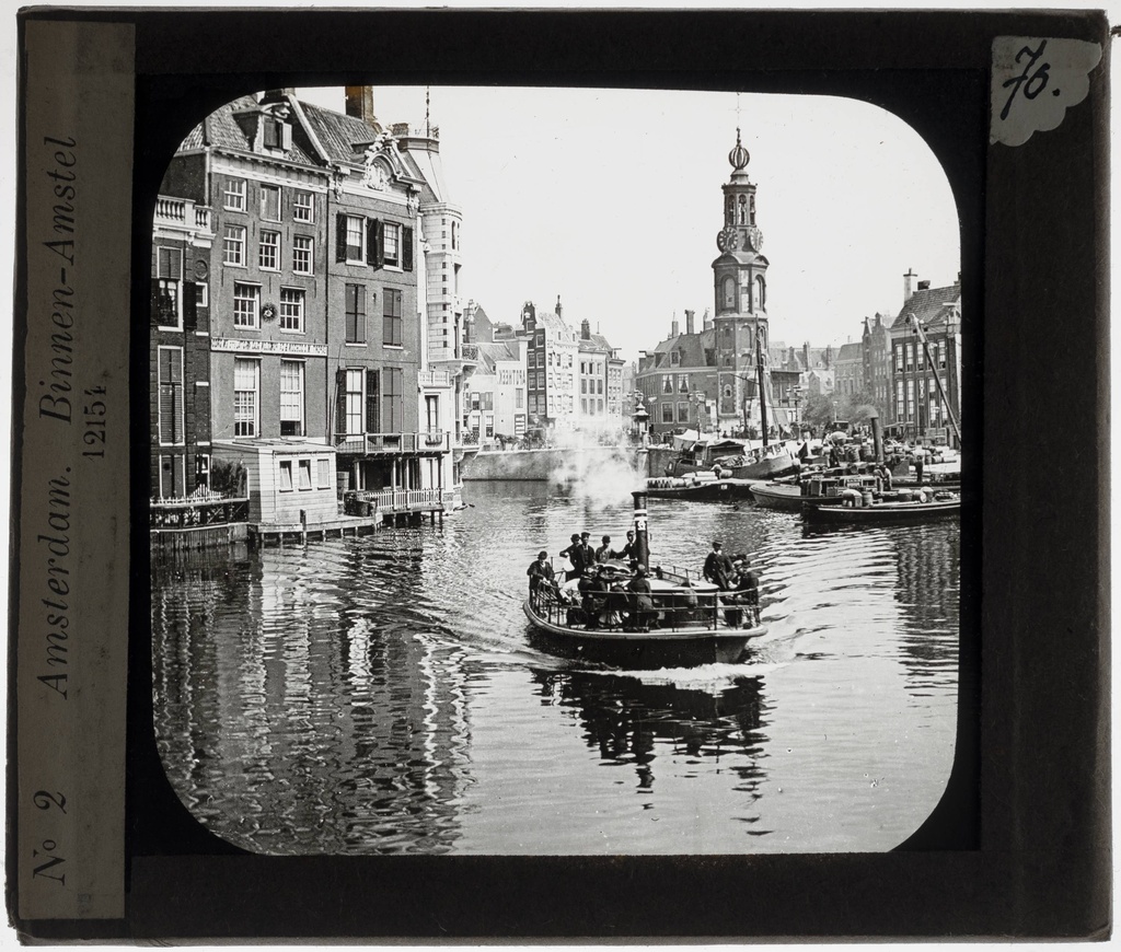 Amsterdam. Boat sails over the Binnen-Amstel, Munttoren in the background - KU Leuven. Glass slides art history. Université de Louvain, between 1839 and 1939. Photographer unknown. Added information on slide. Current / Style: Renaissance. Creation/construction: 1480-1487 (Munttoren). Current location: Netherlands, Amsterdam. EuroPhot. Art History. 15th century. Architecture. Building. EuroPhot. Art history. 15th century. Architecture. Building. EuroPhot. Art History. Various periods. Architecture. City. EuroPhot. Art history. Various periods. Architecture. City.