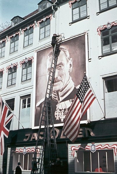 Strøget (the walking street) in Copenhagen decorated with an image of the king.