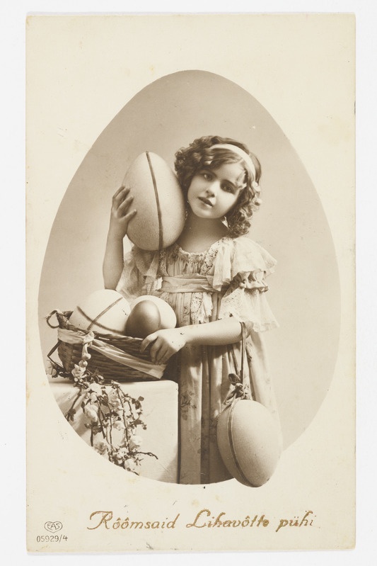 Lihavõttekaart munakorviga tüdrukuga ning tekstiga "Rõõmsaid Lihavõtte pühi!"