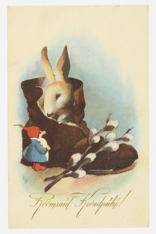 Lihavõttekaart saapas istuva jänesega, teda uudistava päkapikuga ja pajuokstega ning tekstiga "Rõõmsaid Kevadpühi!"