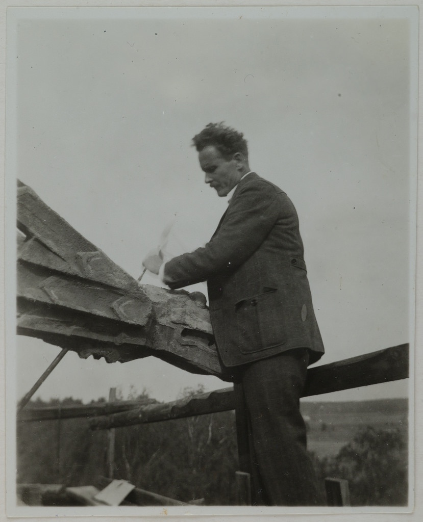 Alpo Sailo at Tarvaspää tower working on a dragon-shaped gargoyle, 1927.