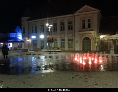 Kuressaare vaade. Värviliste purskkaevude kaskaad õhtusel keskväljakul.  similar photo