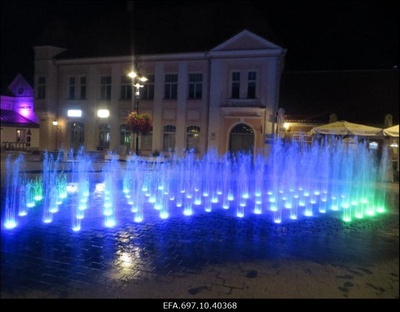 Kuressaare vaade. Värviliste purskkaevude kaskaad õhtusel keskväljakul.  similar photo